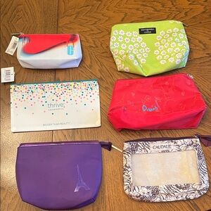 Make up bag bundle. Two new with tags. Four used.
